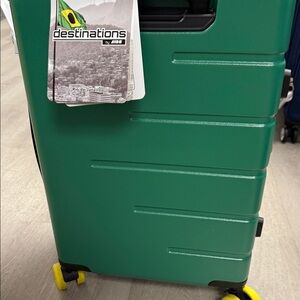 Green Suitcase with Yellow Wheels